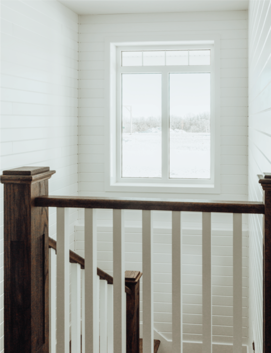 wooden staircase with access window