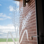 custom entrance door with custom sandblasted image unique for this home