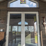 sunroom entrance with a frenchdoor allows for a big entrance area without a post in the way