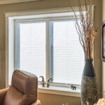 White Tilt and turn double window and blinds and Access Window and Door Design Centre Ltd. pleated blinds.