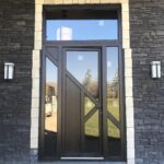 this entrance door has a brown wooden look and feel to it and is a piece of art