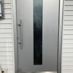 Highperformance silver entrance door with silver custom handle.