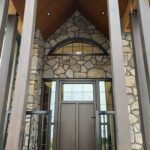 Majestic entrance area featuring a Access custom color entrance door with sidelites and a arched transome.