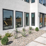 Luxury contemporary home featuring high-performance European windows and doors installed by ACCESS Window and Door Design Centre.